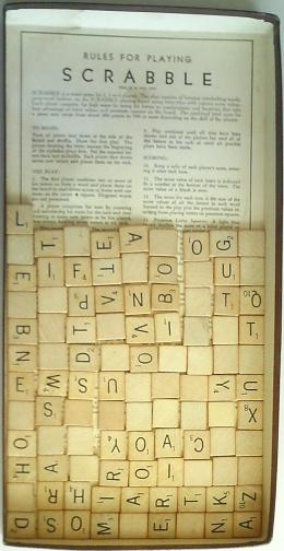 Scrabble Tiles in box 
top; eleven rows of nine, plus one left over.